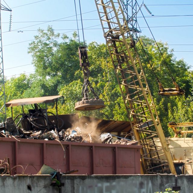 Image of junkyard with old metal waste in industrial zone